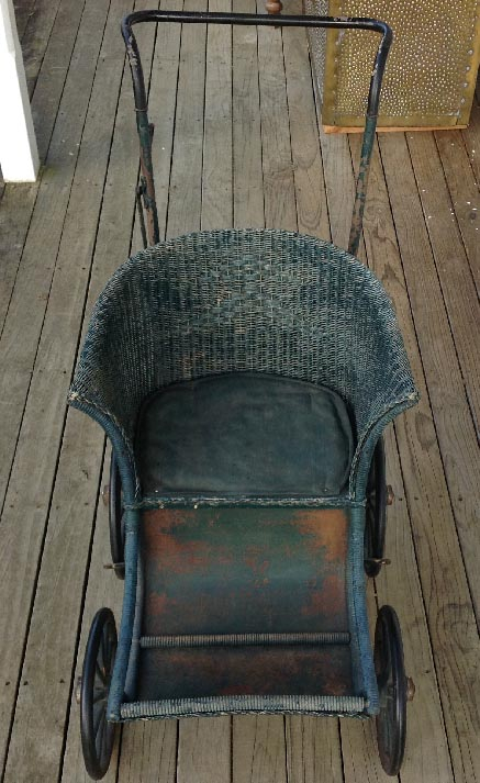 antique cane push chair with metal fittings wheels wooden spokes rubber rims Dolls and Teddy Bears